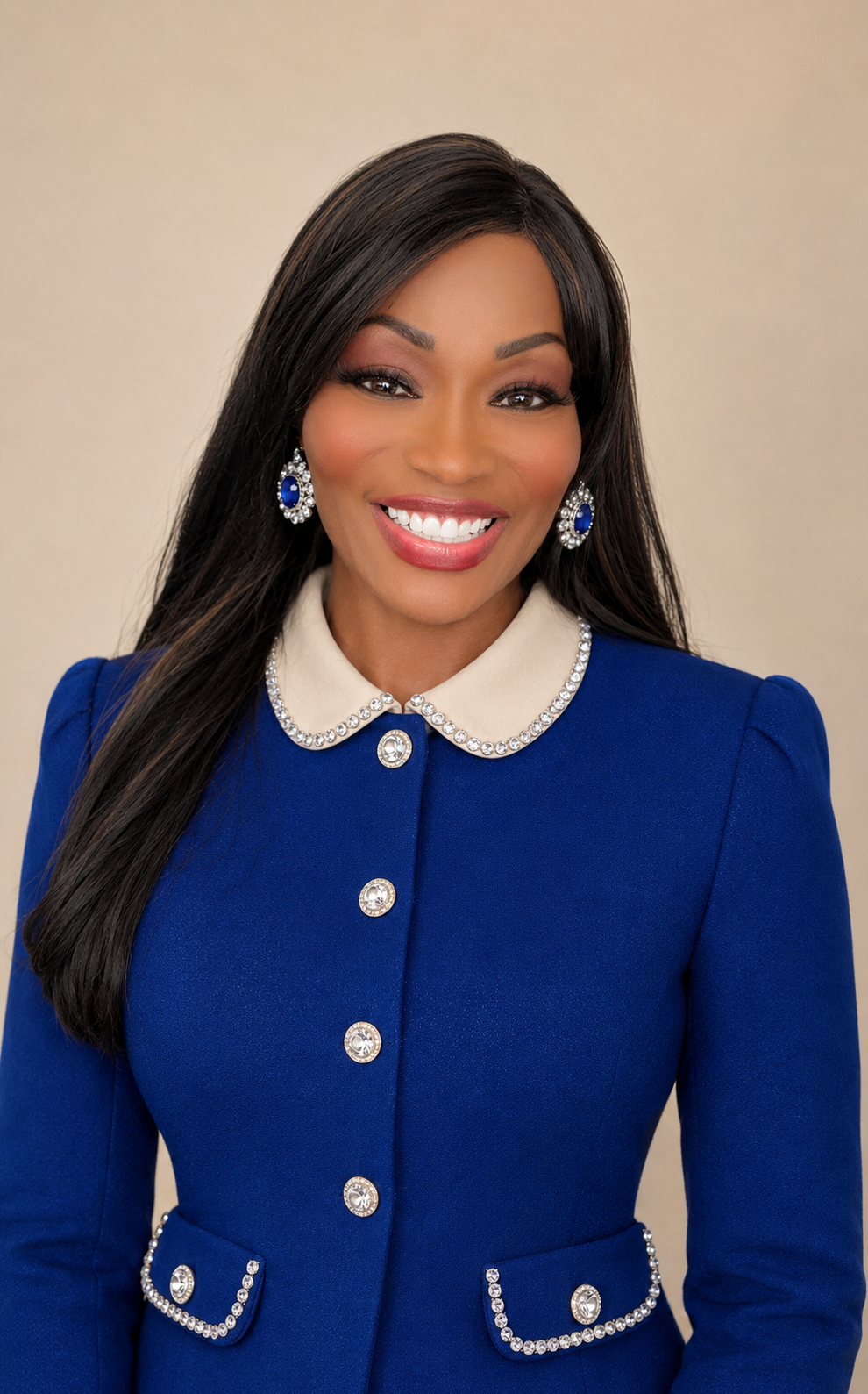 Dr. Felicia Banks in a royal-blue suit with diamond details